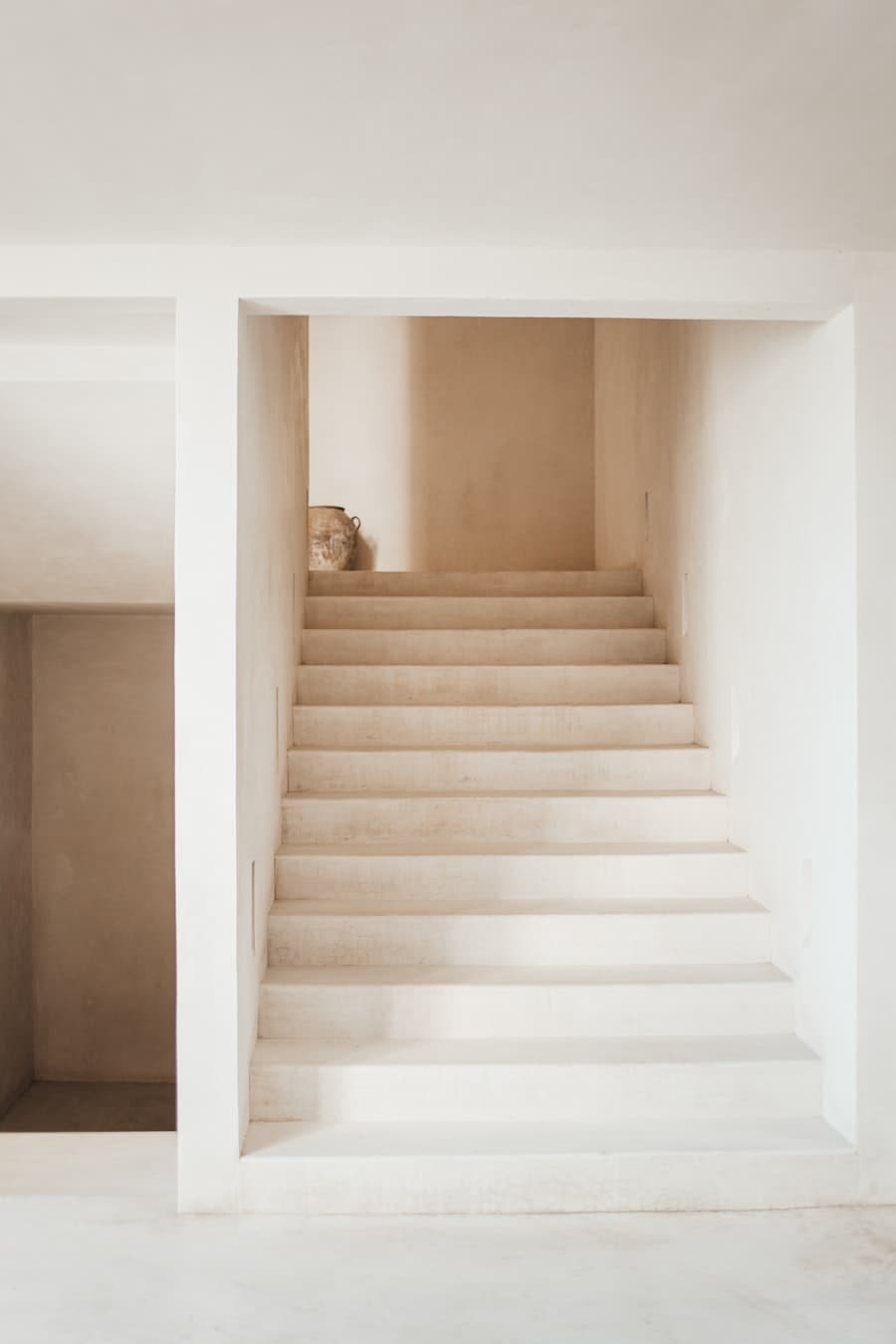 Soft plaster stairwell in warm daylight
